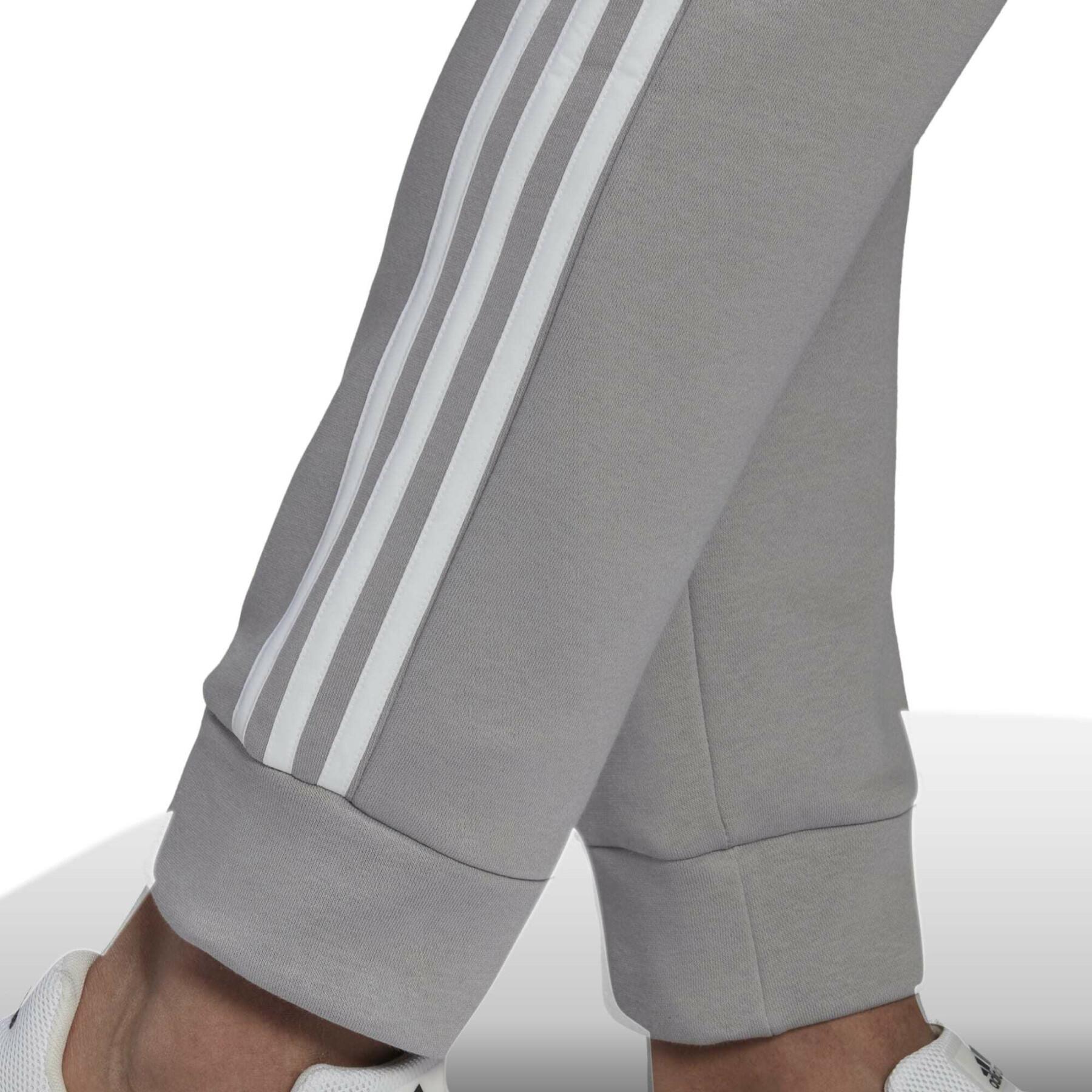 Joggingdräkt i fleece adidas Essentials