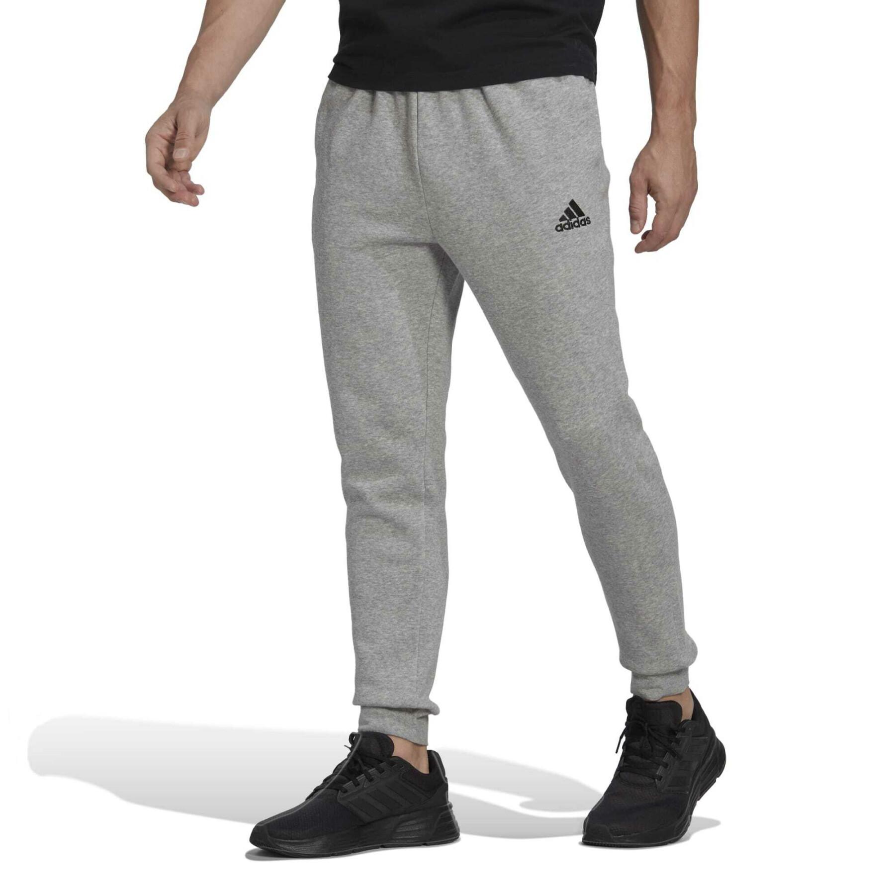 Avsmalnande joggingbyxor i fleece adidas Essentials